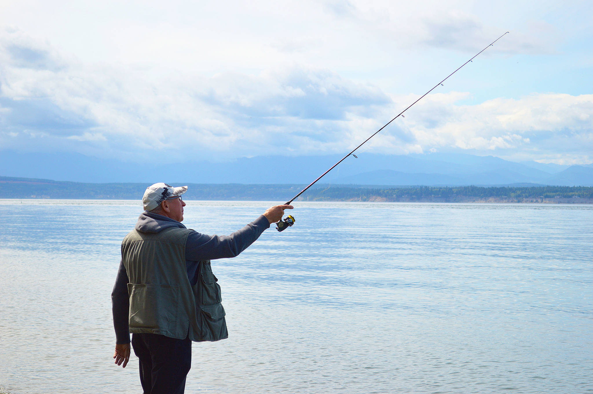 Photo by Laura Guido/Whidbey News-Times                                Lorne Balanko casts his line Thursday at Bush Point. Atlantic salmon from the recent net pen failure have been reportedly caught in the area, as well as other places around Whidbey.