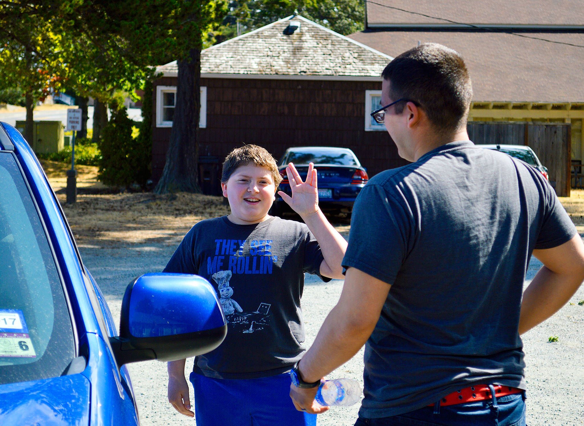 Matthew Smith flashes the “live long and prosper” sign before leaving with his “Big,” James Lopez, to go get ice cream. The two have been matched for eight months through Big Brothers Big Sisters Island County’s community-based mentoring program. The two are self-described “nerds.” Photo by Laura Guido/Whidbey News-Times