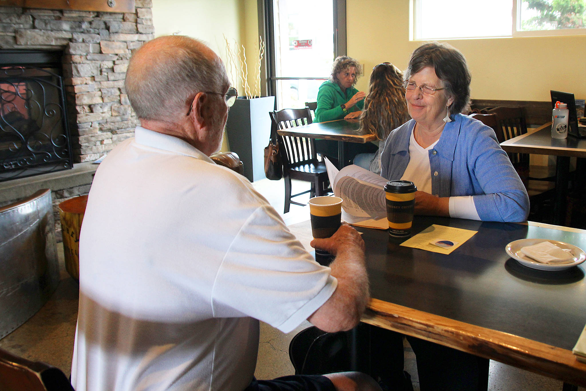 Photo by Jessie Stensland/Whidbey News-Times                                South Whidbey resident Cathy Whitmire and Oak Harbor City Councilman Jim Campbell discuss the new Civility First group at coffee Thursday morning.