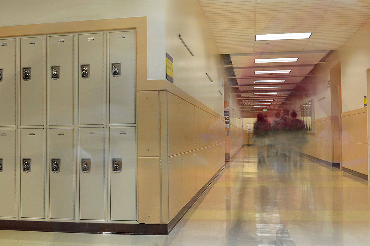 Students walking through the hallway between classes at Oak Harbor High School. The district is working with the group Forefront to promote suicide prevention for its high school students. Photo by Laura Guido/Whidbey News-Times