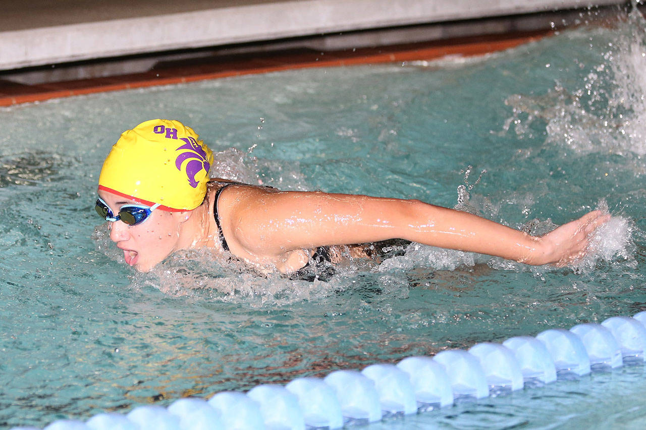 Caitlin Dennen swims to fourth place in the 100 butterfly. (Photo by John Fisken)