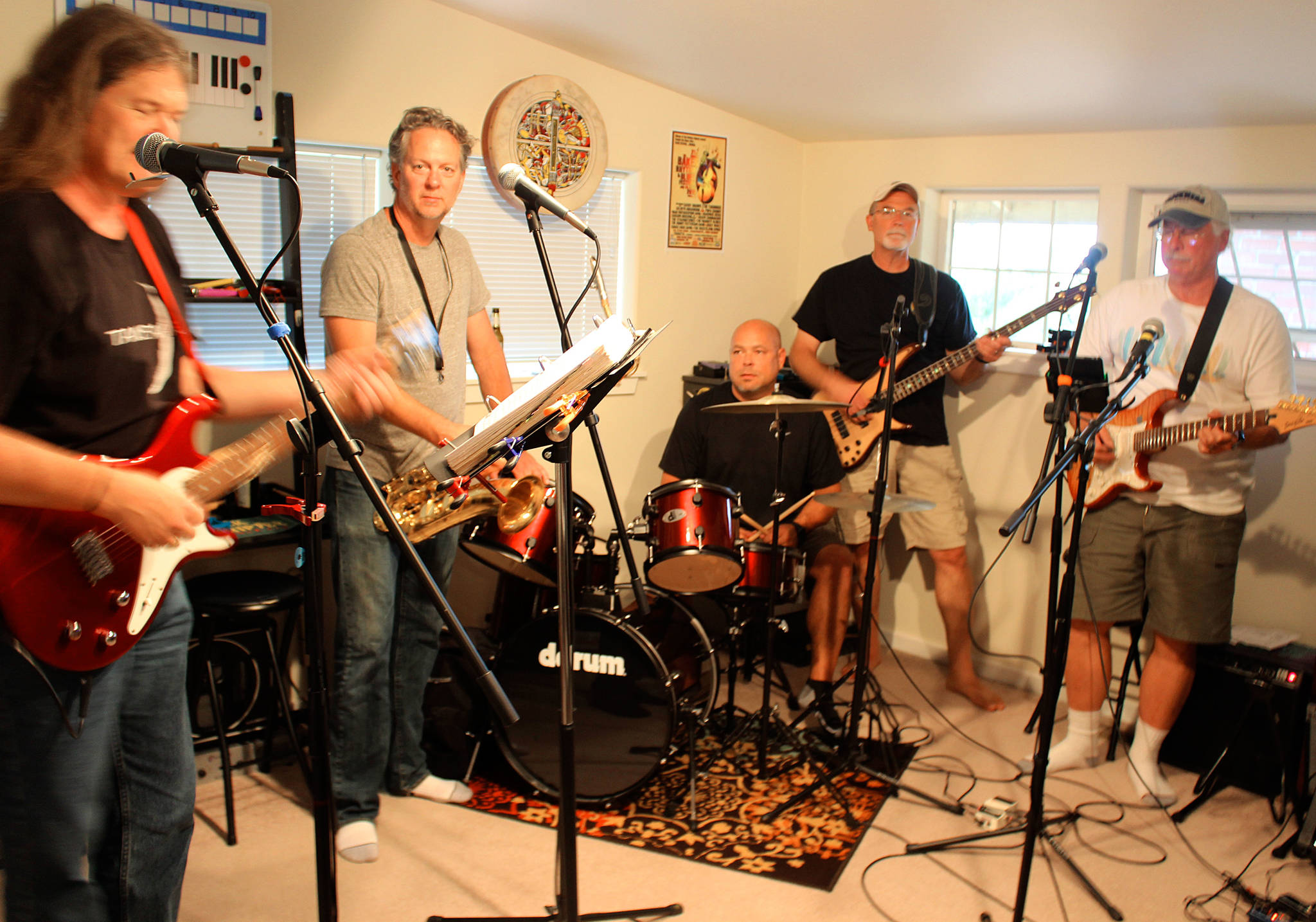 Mussel Flats band members left to right; Steve DeHaven, Doug Coutts, Mitch Aparicio, Mark Wacker and Rich Cannon meet at DeHaven’s home for weekly rehearshal. Photo by Patricia Guthrie/Whidbey News-Times