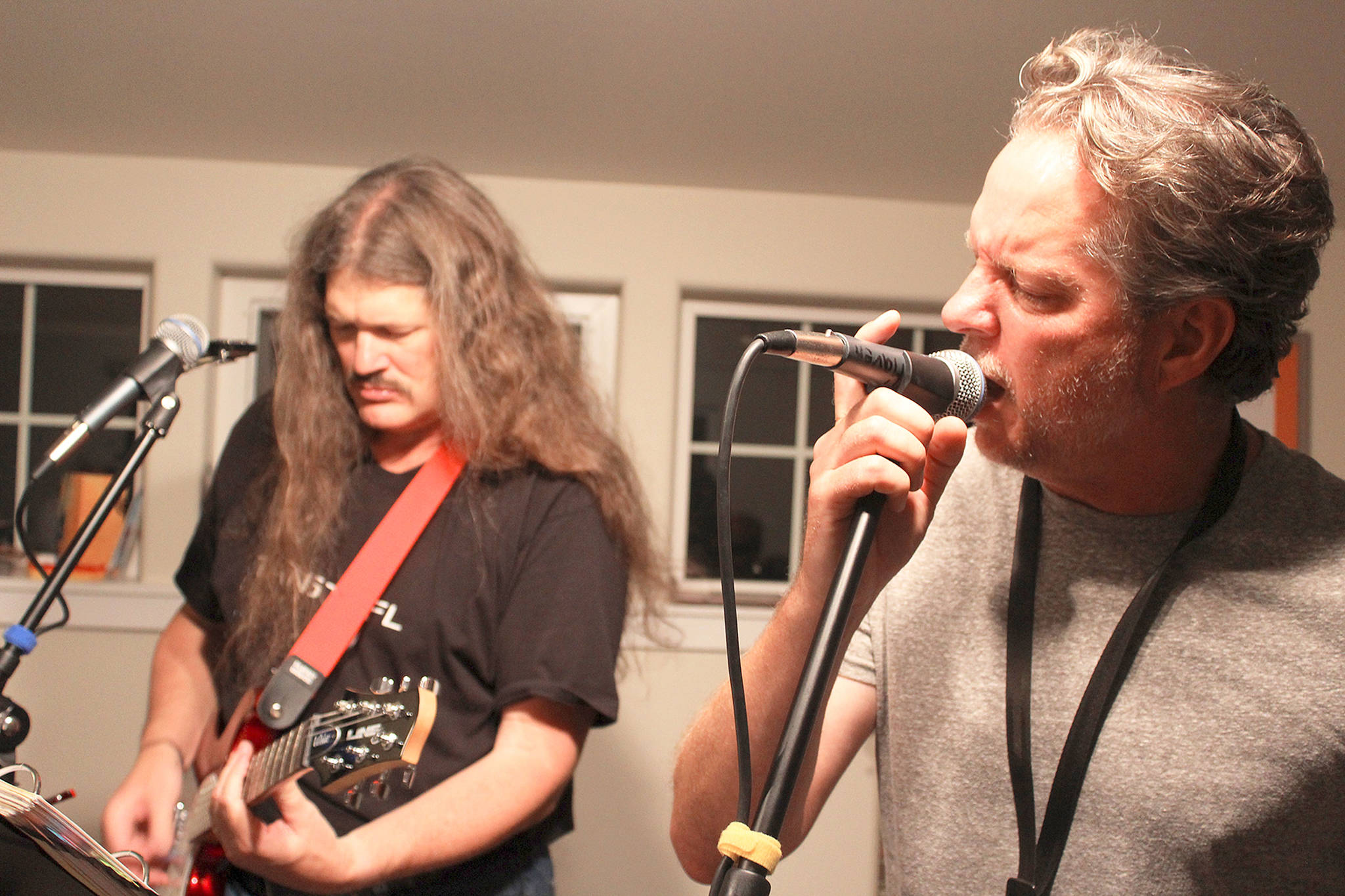 Steve DeHaven (left) and Doug Coutts provide lead vocals for many of the classic rock songs played by Mussel Flats. Photo by Patricia Guthrie/Whidbey News-Times