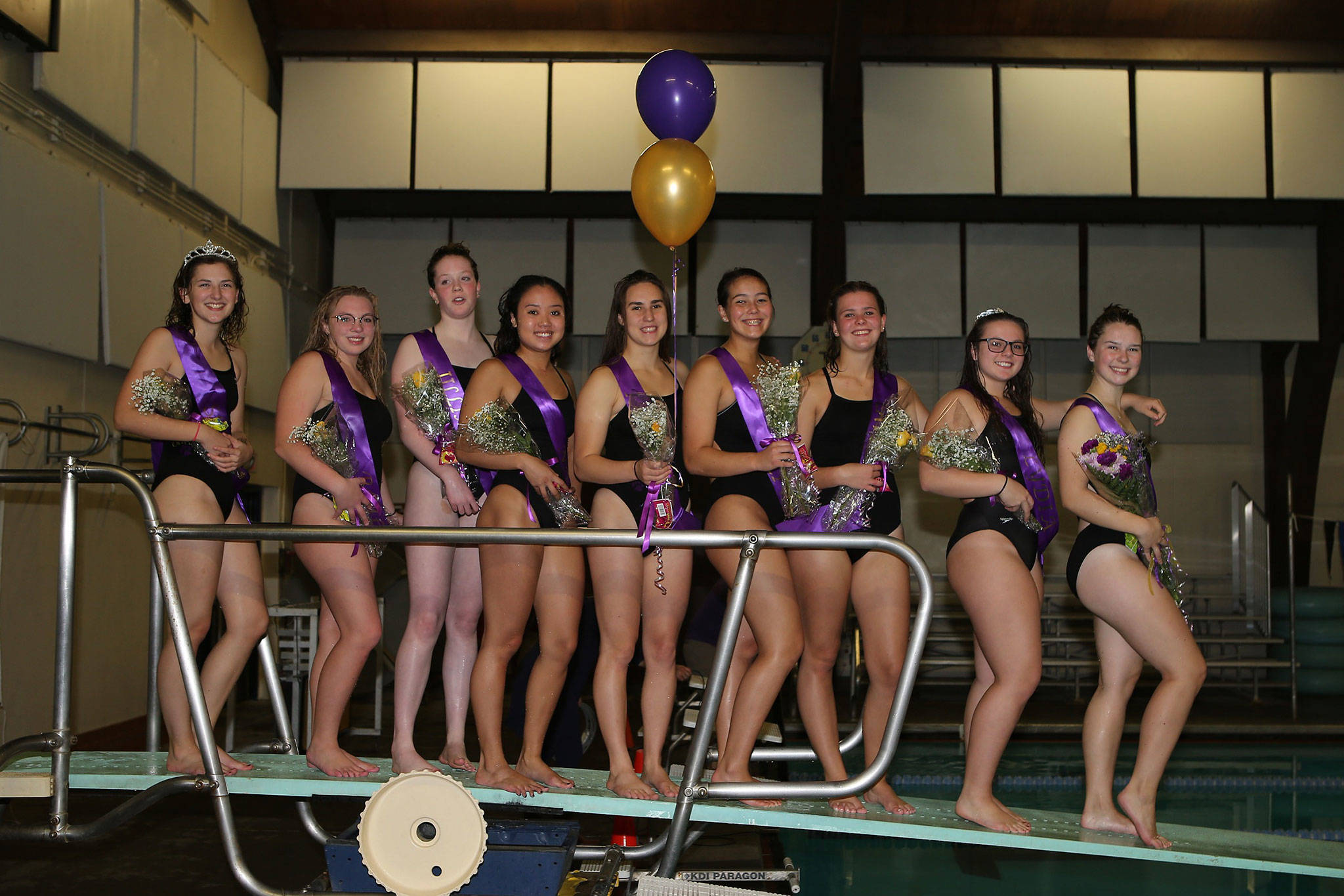 The senior members of the Oak Harbor High School swim and dive team pose after their final home meet. From the left are Scout Powell, Bailie Carroll, Jillian Pape, Naomi Garcia, Taliah Black, Olivia Tungate, Lavinia Liatti, Lydia Dorsey and Baelee Whitinger. (Photo by John Fisken)