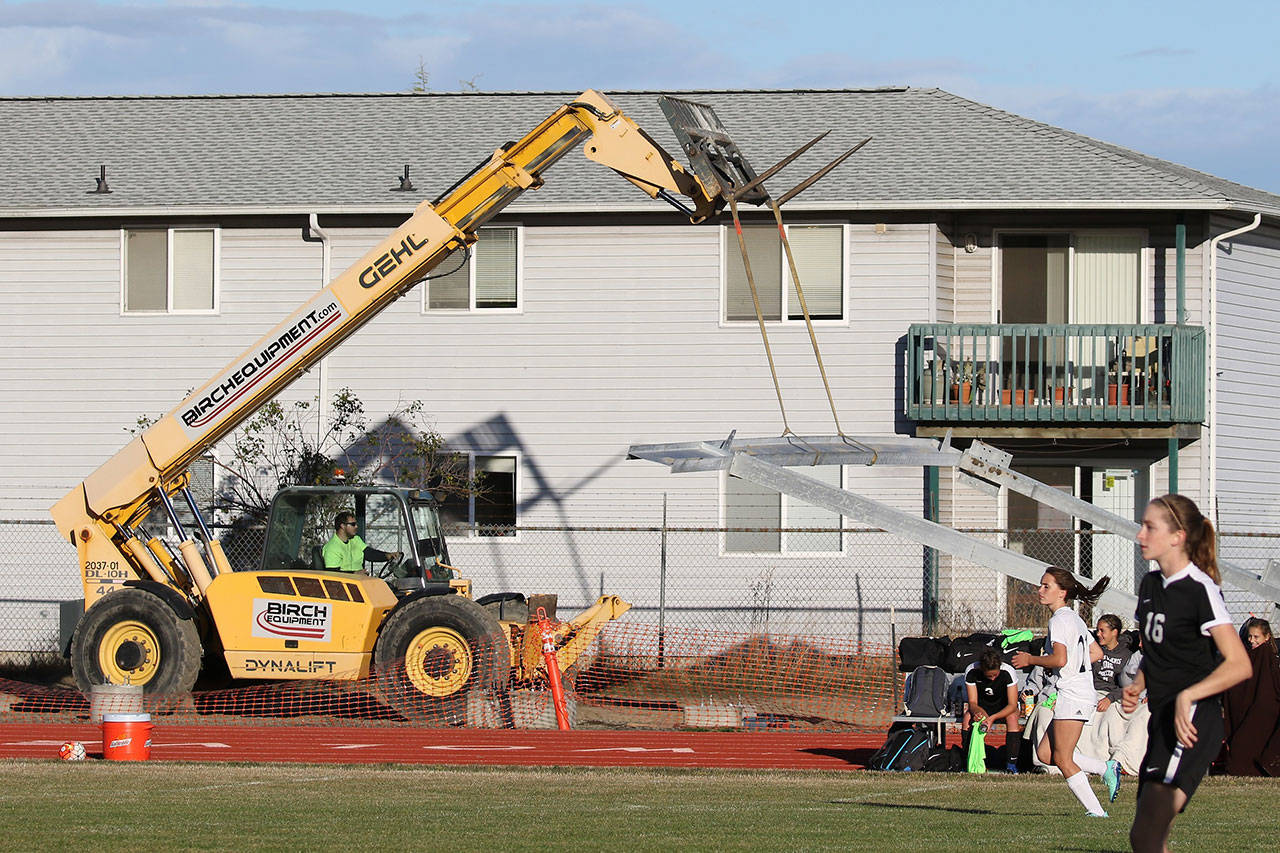 The new bleachers at Mickey Clark Field go up as Coupeville and Sequim compete in a soccer match Tuesday. (Photos by John Fisken)
