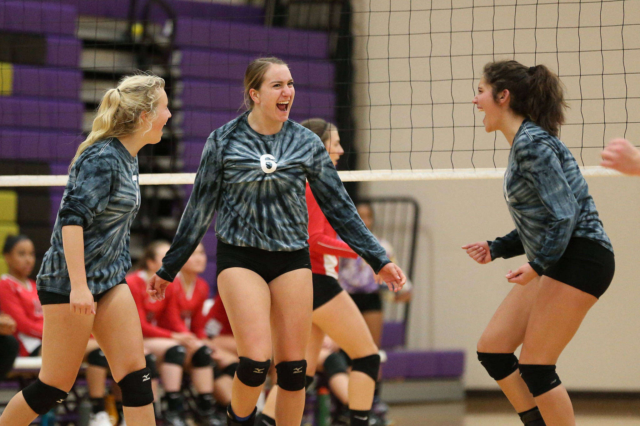 Cami Bristow, left, Samantha Hines and Kristina Tirado are all smiles after a Hines kill.(Photo by John Fisken)