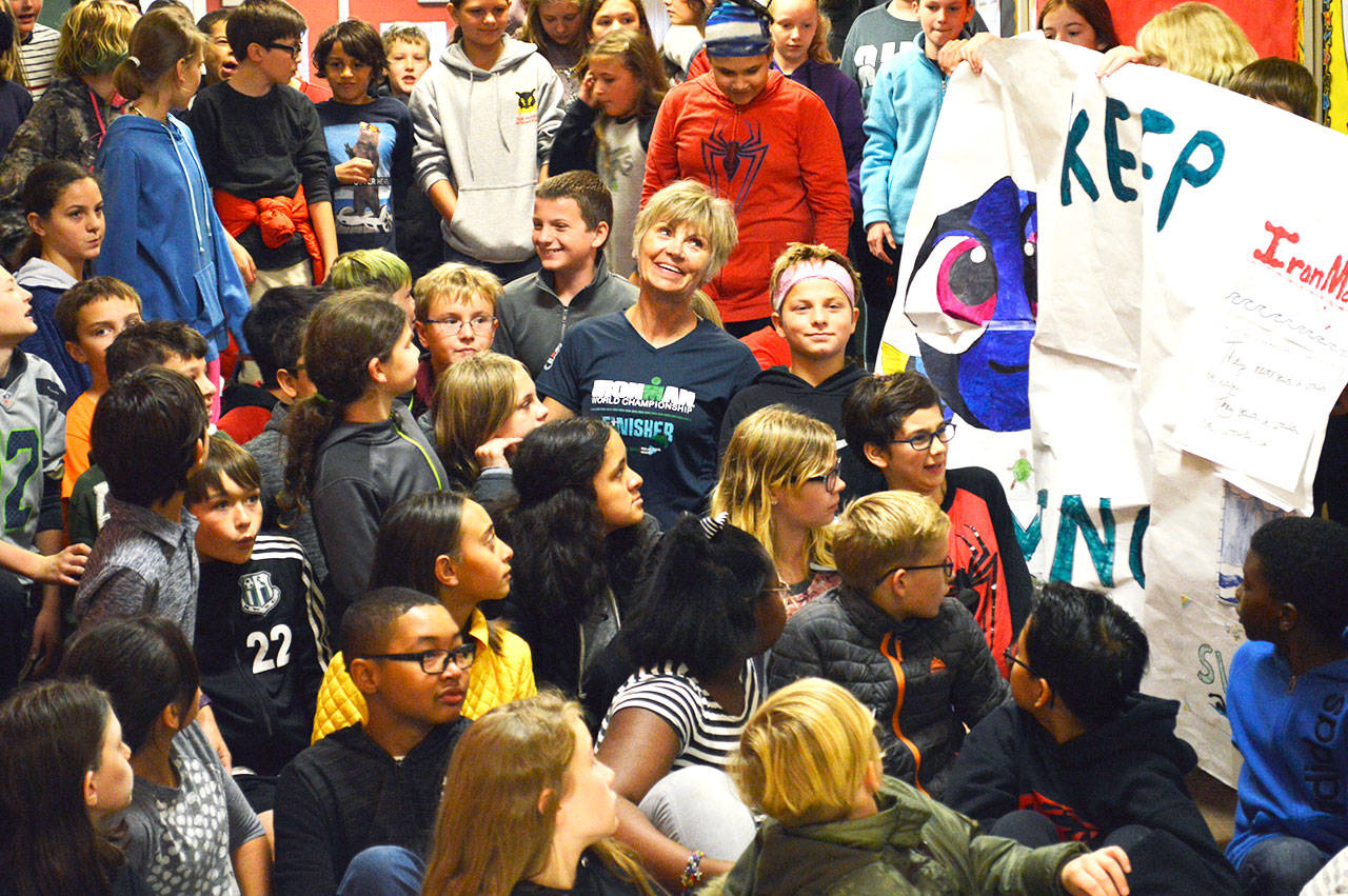 Christina Bromme, a sixth-grade science teacher at Oak Harbor Intermediate School, is welcomed back by her students from the Ironman World Championships in Kona.