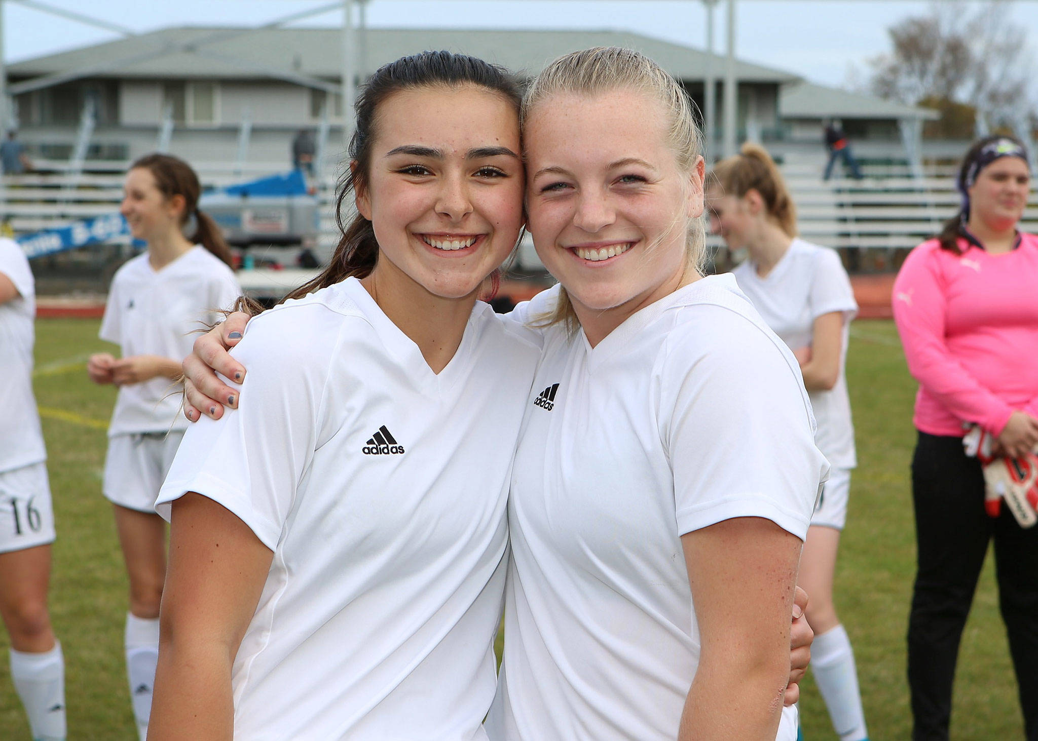 Coupeville senior captains Lauren Bayne, left, and Sage Renninger played their final game at Mickey Clark Field Monday. (Photo by John Fisken)