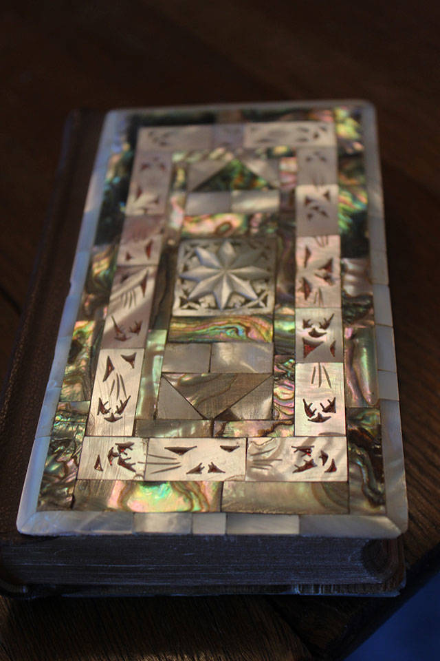 The Bible cover is made with mother of pearl and abalone.