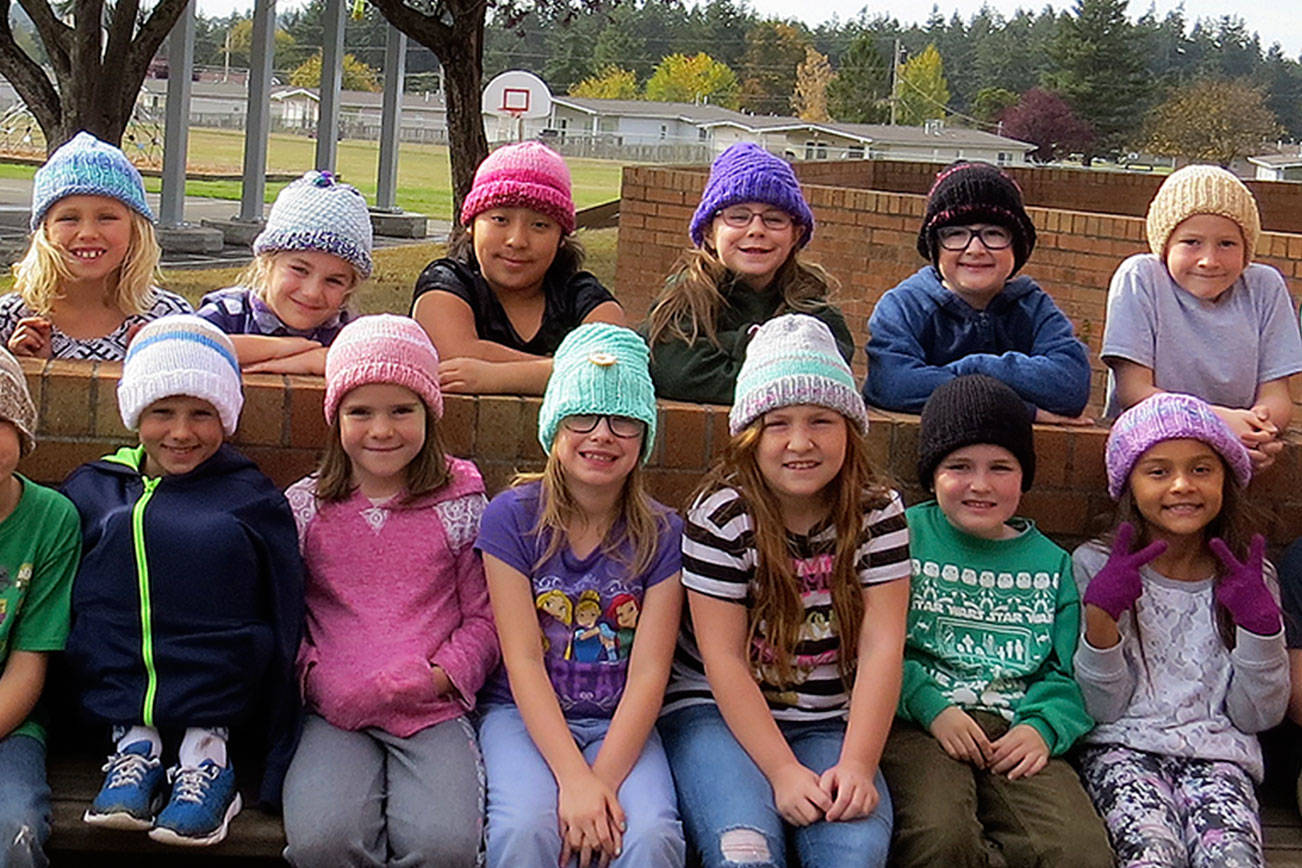 Neighborhood knitter makes hats for classroom