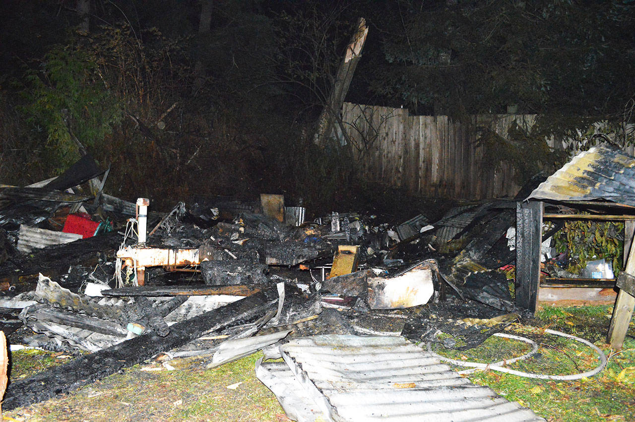 A camper trailer caught fire around 4:30 p.m. Sunday. The fire was quickly extinguished, but nothing remained of the trailer. No one was injured. Photo by Laura Guido/Whidbey News-Times