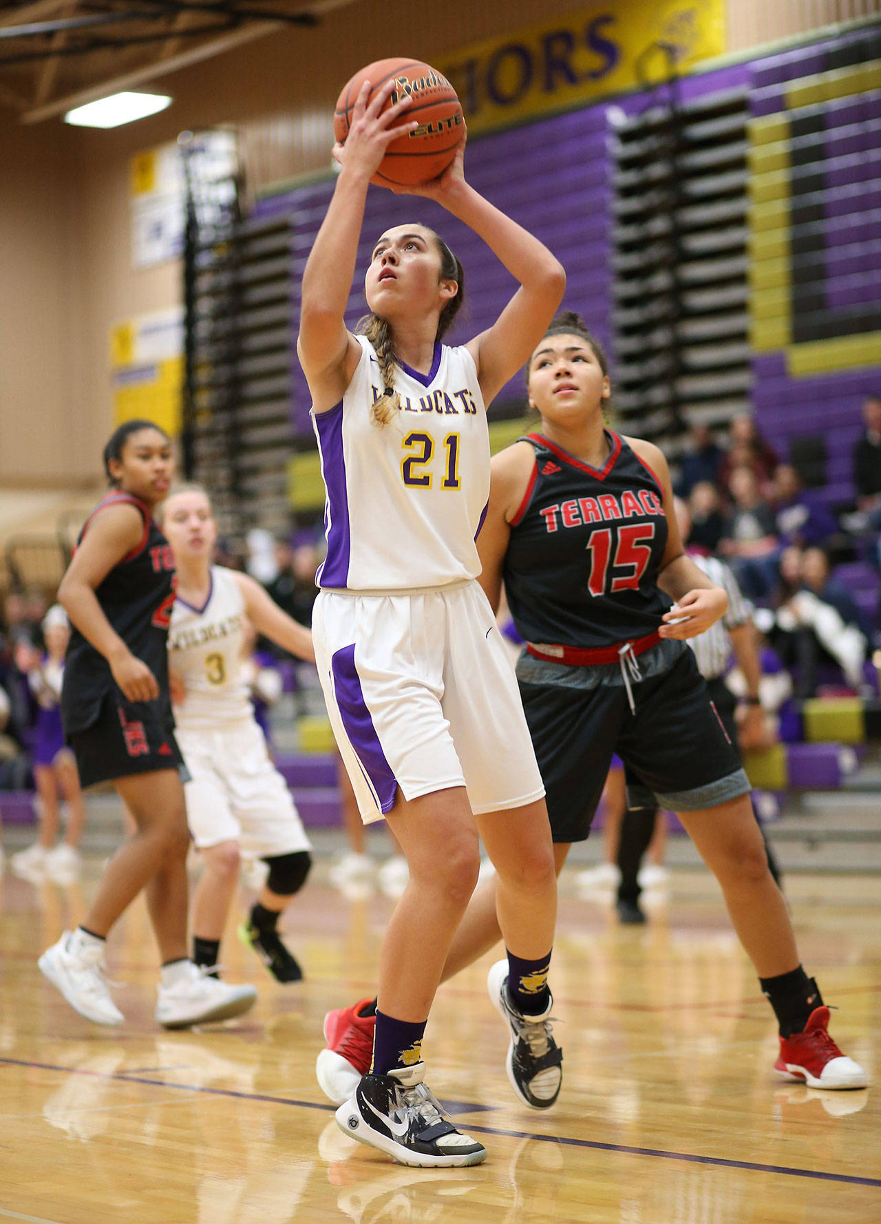 Oak Harbors Mikhaela Cortez puts up a left-handed shot in front of Mountlake Terraces Anyika Nuckles. (Photo by John Fisken)