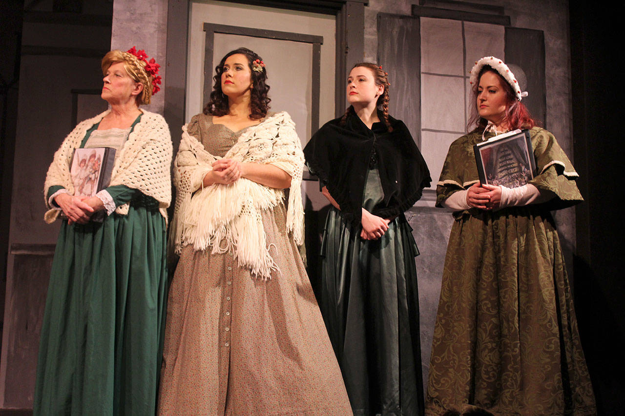 The Madrigal Singers perform old seasonal songs during “A Christmas Carol.” From left to right: Geri Thomas, Lauren Gutschlag, Tatyana Moore, Danielle Wright. Moore is also co-director, along with Eric George.