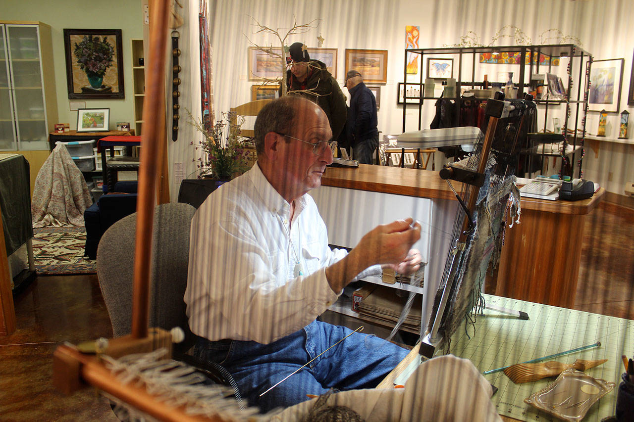 Windwalker Taibi, shown here weaving inside Raven Rocks Gallery at Greenbank Farm, will be among businesses, organizations and residents celebrating at Saturday’s “We Bought the Farm” activities. Photos by Patricia Guthrie/Whidbey News-Times
