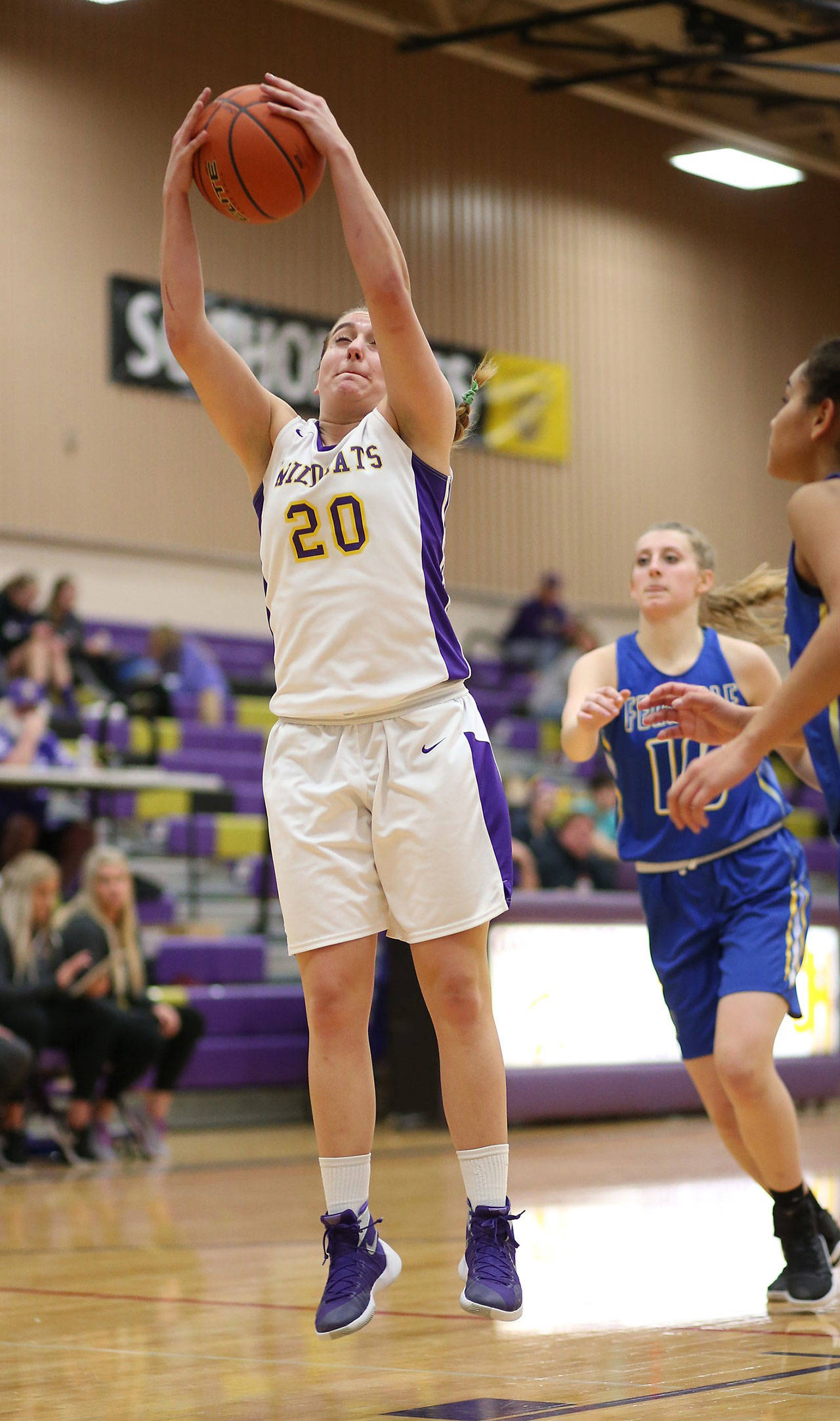 Samantha Hines hauls in a rebound against Ferndale Monday. Earlier this season she tied the school’s single-game rebounding record with 26. (Photo by John Fisken)
