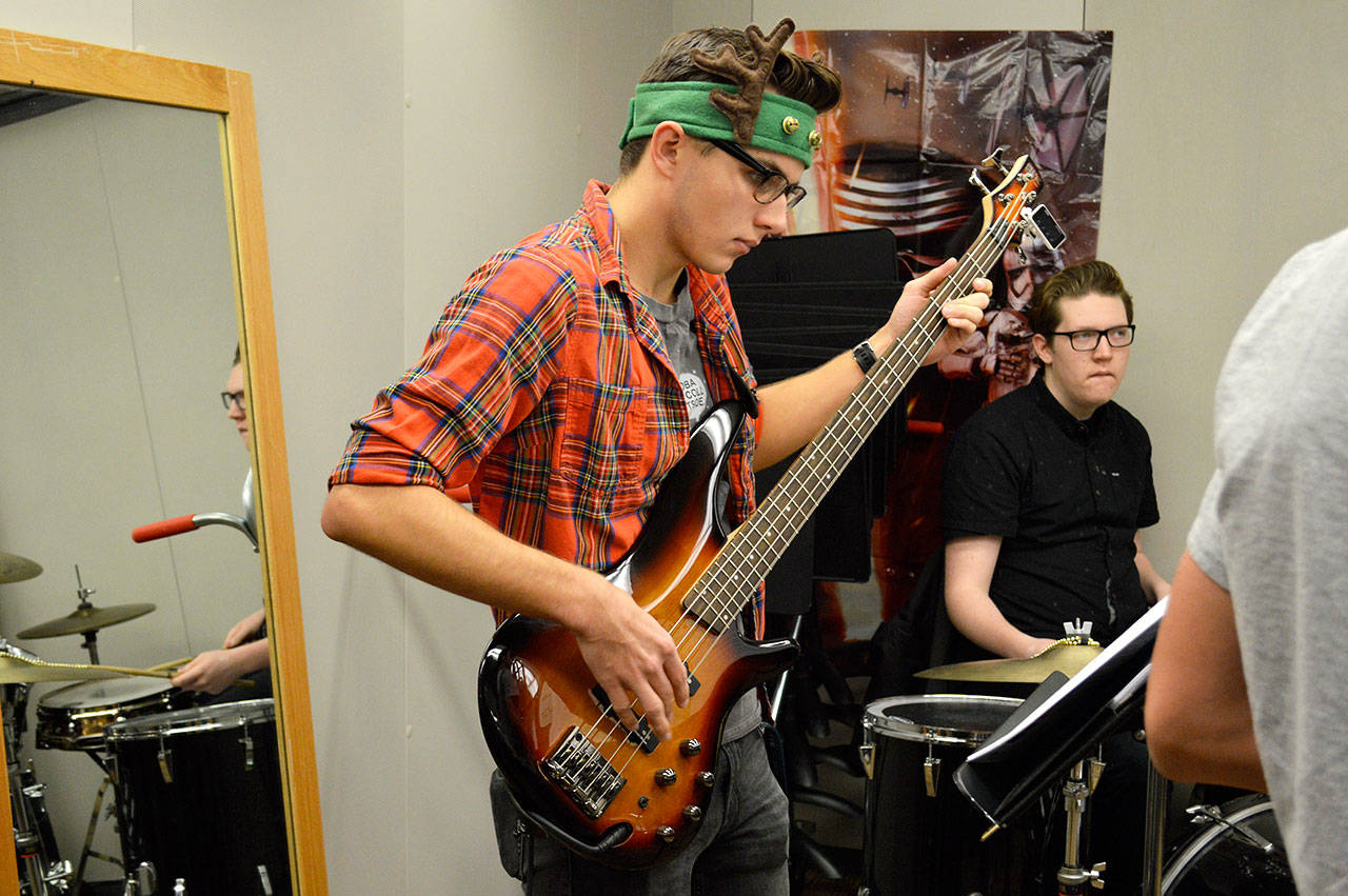 Jordan George plays the bass during a new improv jazz class taught by Lance Gibbon, superintendent of Oak Harbor Schools, and Jason Schmid, an Oak Harbor Intermediate School science teacher. Photo by Laura Guido/Whidbey News-Times