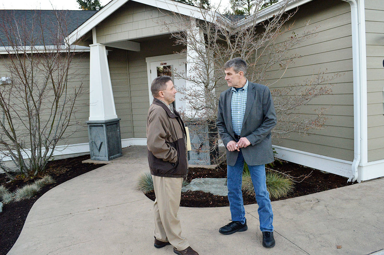 Larry Van Horn, county facilities management director, and Commissioner Rick Hannold, stand outside the property that will be the new north precinct for the Island County Sheriff’s Office. Photo by Laura Guido/Whidbey News-Times