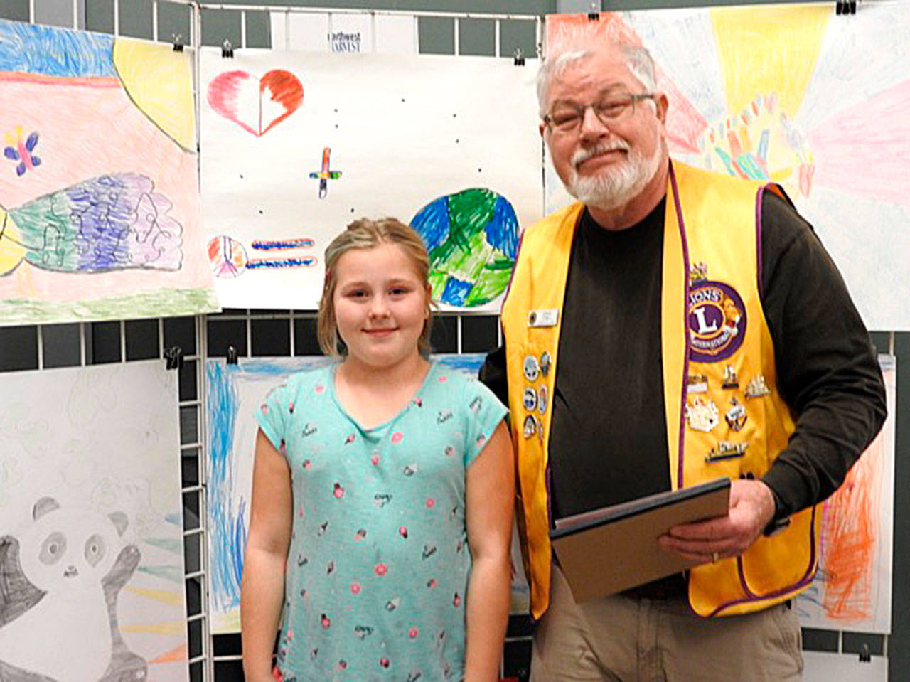 Photo provided                                Coupeville Lions President Dave Fish, right, with Peace Poster Contest winner Tara Halterman.