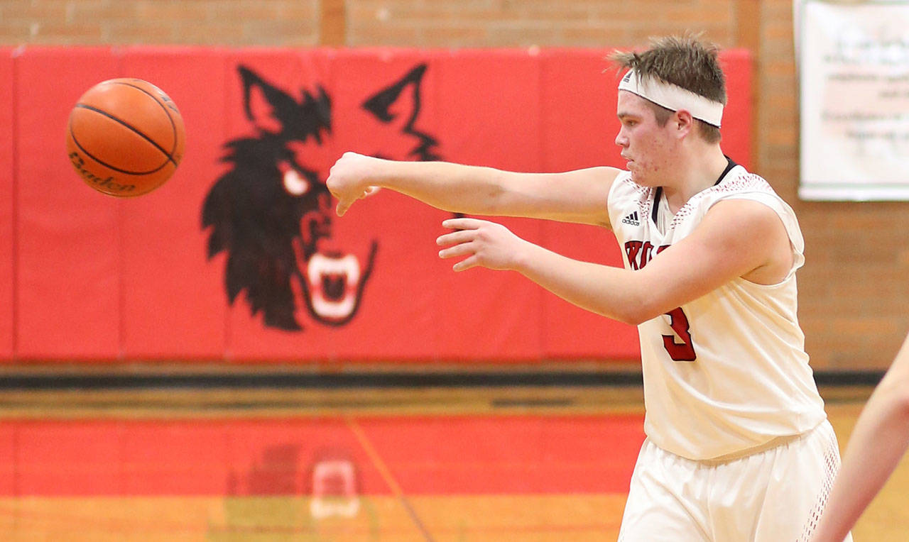 Hunter Downes passes for Coupeville in Friday’s game with Orcas Island.(Photo by John Fisken)