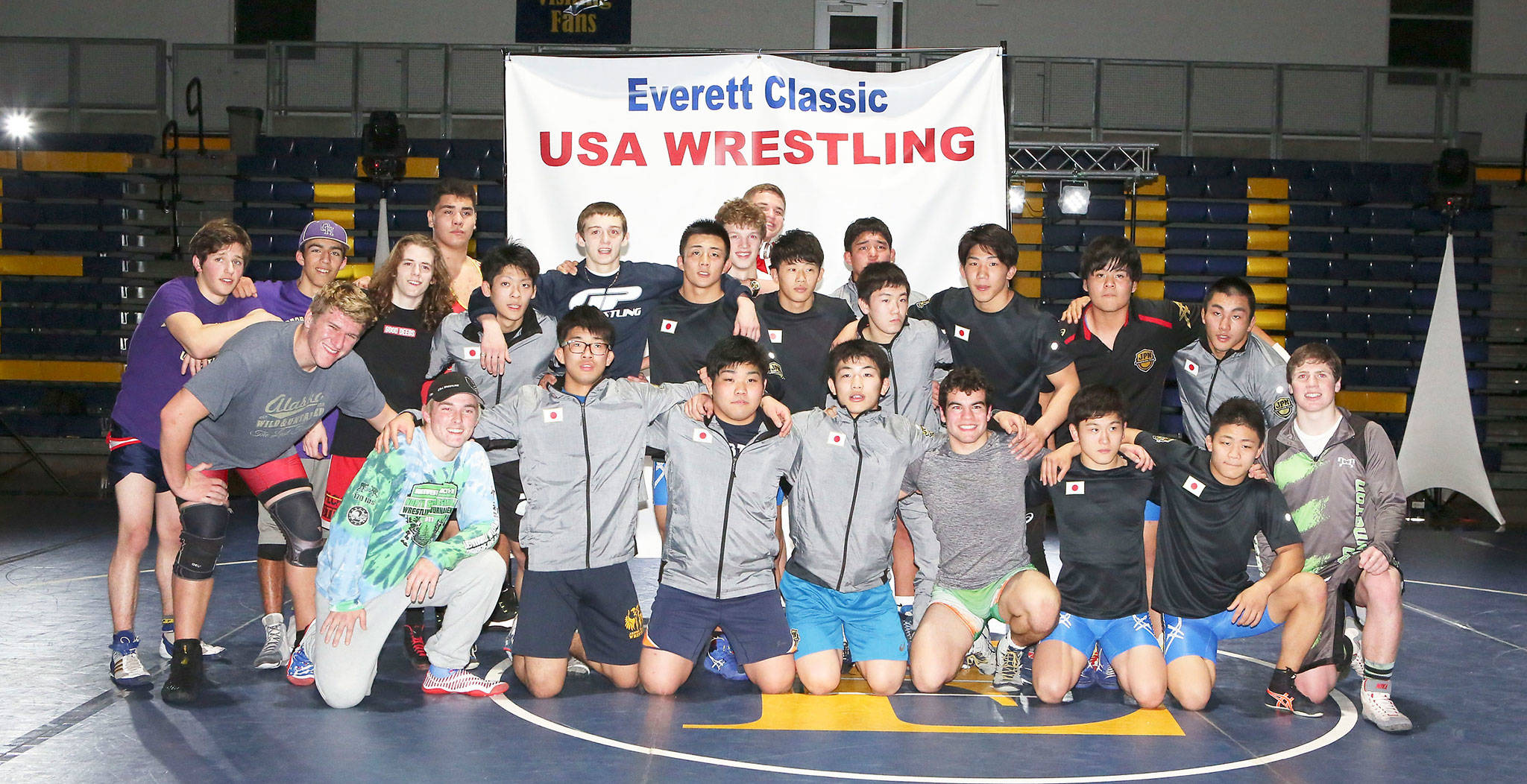 Three Oak Harbor wrestlers and the regional all-stars pose with the members of the Japanese Natonal Junior team after their meet Friday in Everett. The Wildcats are at the far left, Blake McBride, Caleb Fitzgerald and Michael Fisken. (Photo by John Fisken)