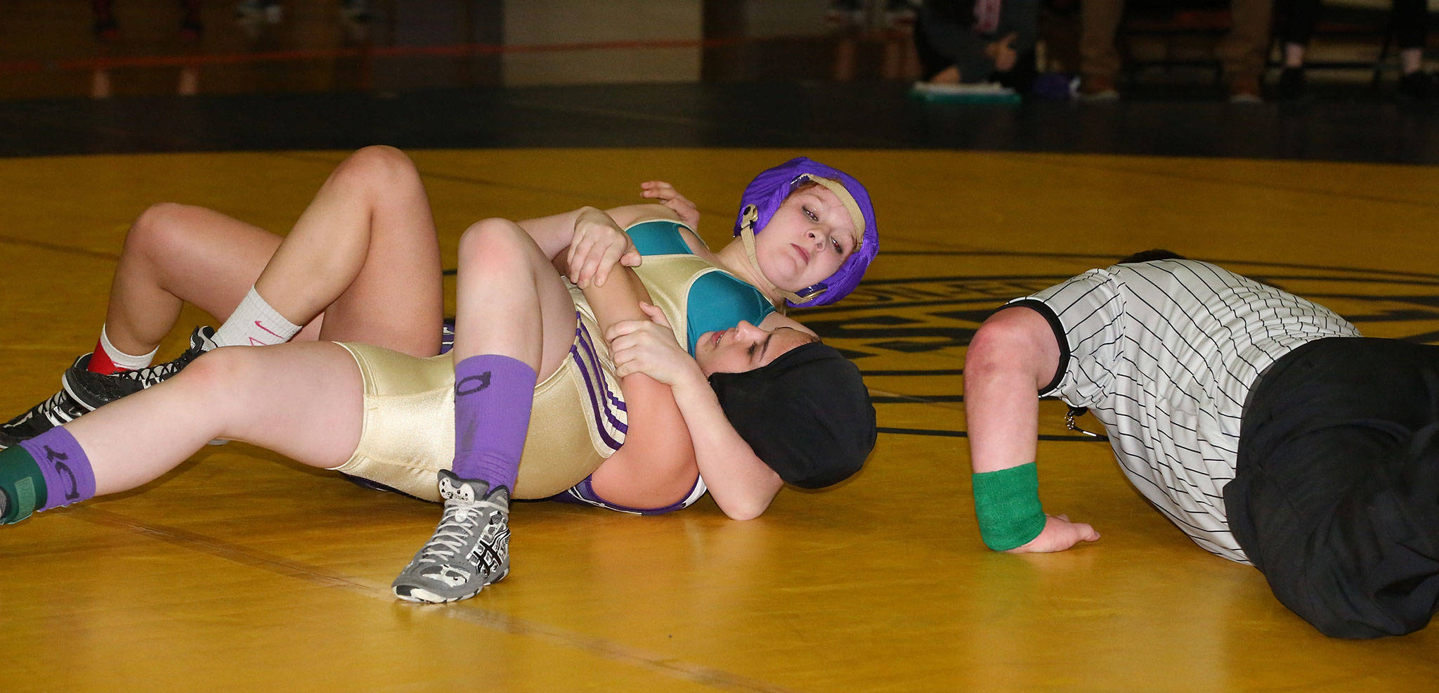 Elizabeth Clairmont, top, records one of her two pins at Burlington-Edison.(Photo by John Fisken)