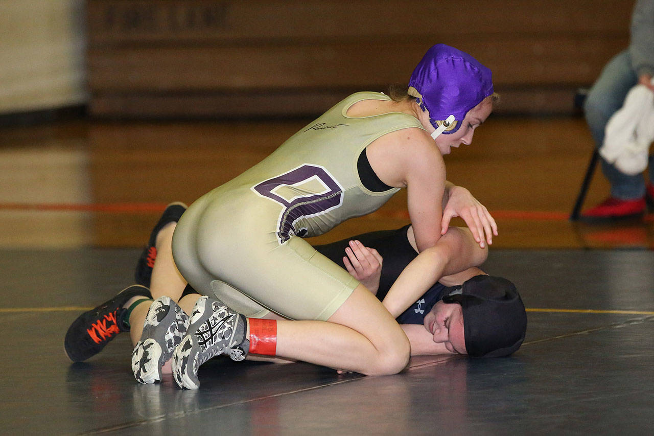 Autumn Coker, top, tries to turn her opponent.(Photo by John Fisken)