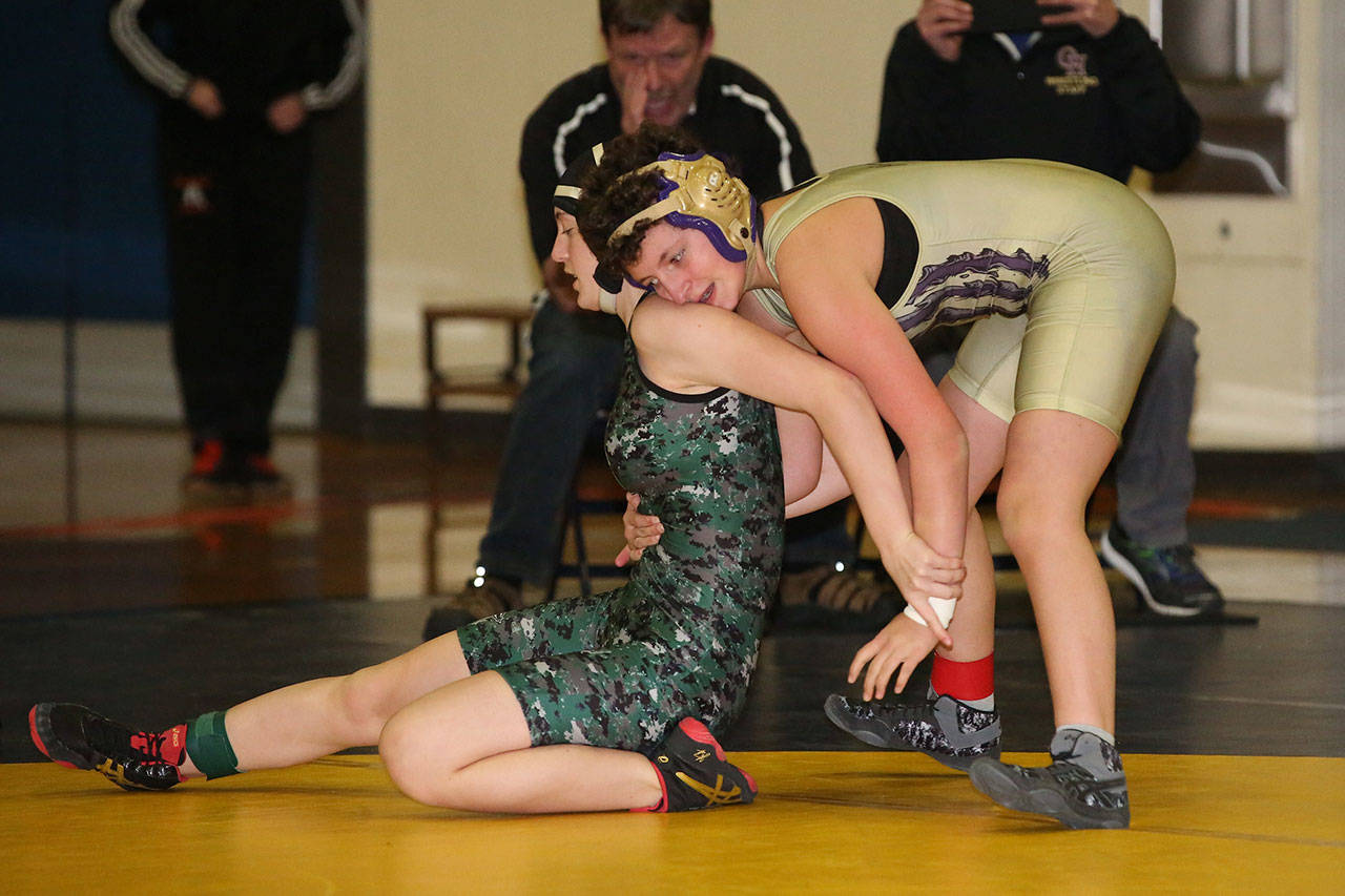 Oak Harbor’s Taylor Cress, right, works to prevent her opponent from escaping.(Photo by John Fisken)