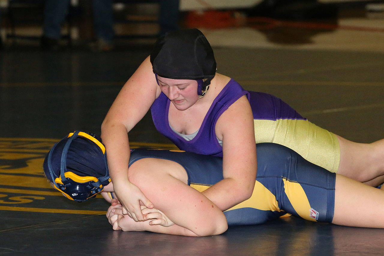 Cheyanne Winchester, right, sets up a hold in one of her matches Wednesday.(Photo by John Fisken)