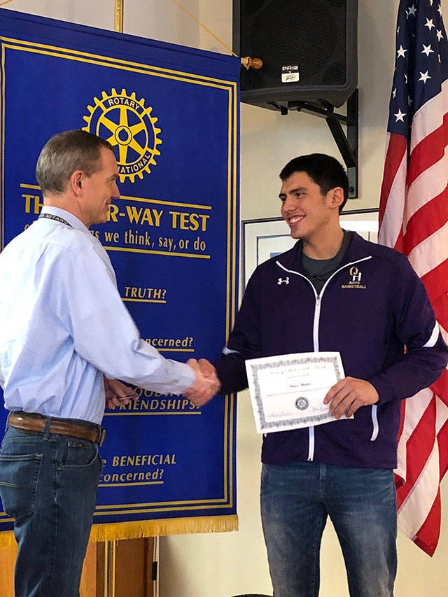 Rotary Club president Steve Powers presents Weston Whitehead with his student of the month certificate. Photo provided