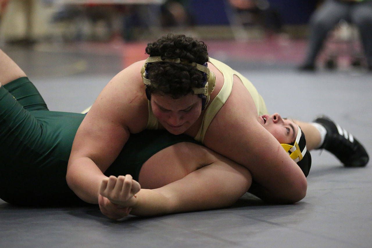 Nathan Nunez, top, shown here in a match earlier this season, placed first in the JV championships last weekend. (Photo by John Fisken)