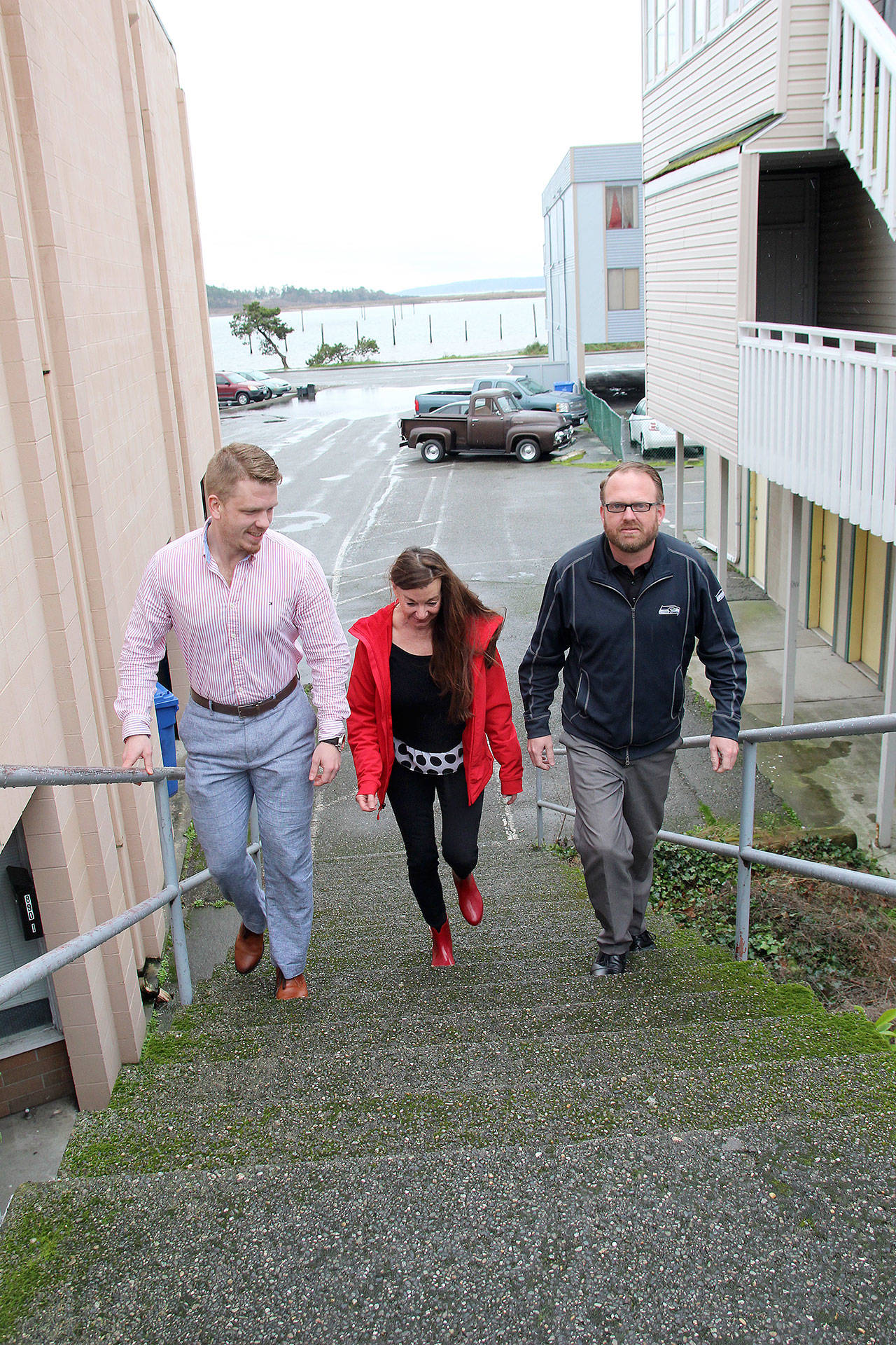 Photo by Jessie Stensland / Whidbey News-Times                                Main Street Executive Director Matthew Williams, left, walks up Serendipity Lane with Dan Evans, president of the Main Street board of directors, and Rhonda Severns, also a member of the board.