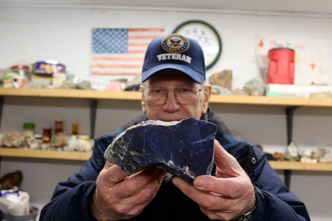Richard James, treasurer of the the Whidbey Island Gem Club, holds up one of many colorful rocks to be on display or for sale at this weekends 53rd Annual Sweetheart of Gems Show at Oak Harbor Senior Center. Photos by Patricia Guthrie/Whidbey News-Times