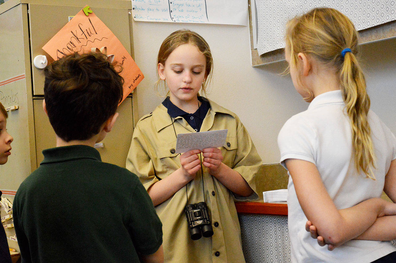 Fourth-grader Zoe Stannford, dressed as Jane Goodall, talk’s about the primatologist to students from other grade levels during the “wax museum” at Oak Harbor Elementary. Photo by Laura Guido/Whidbey News-Times