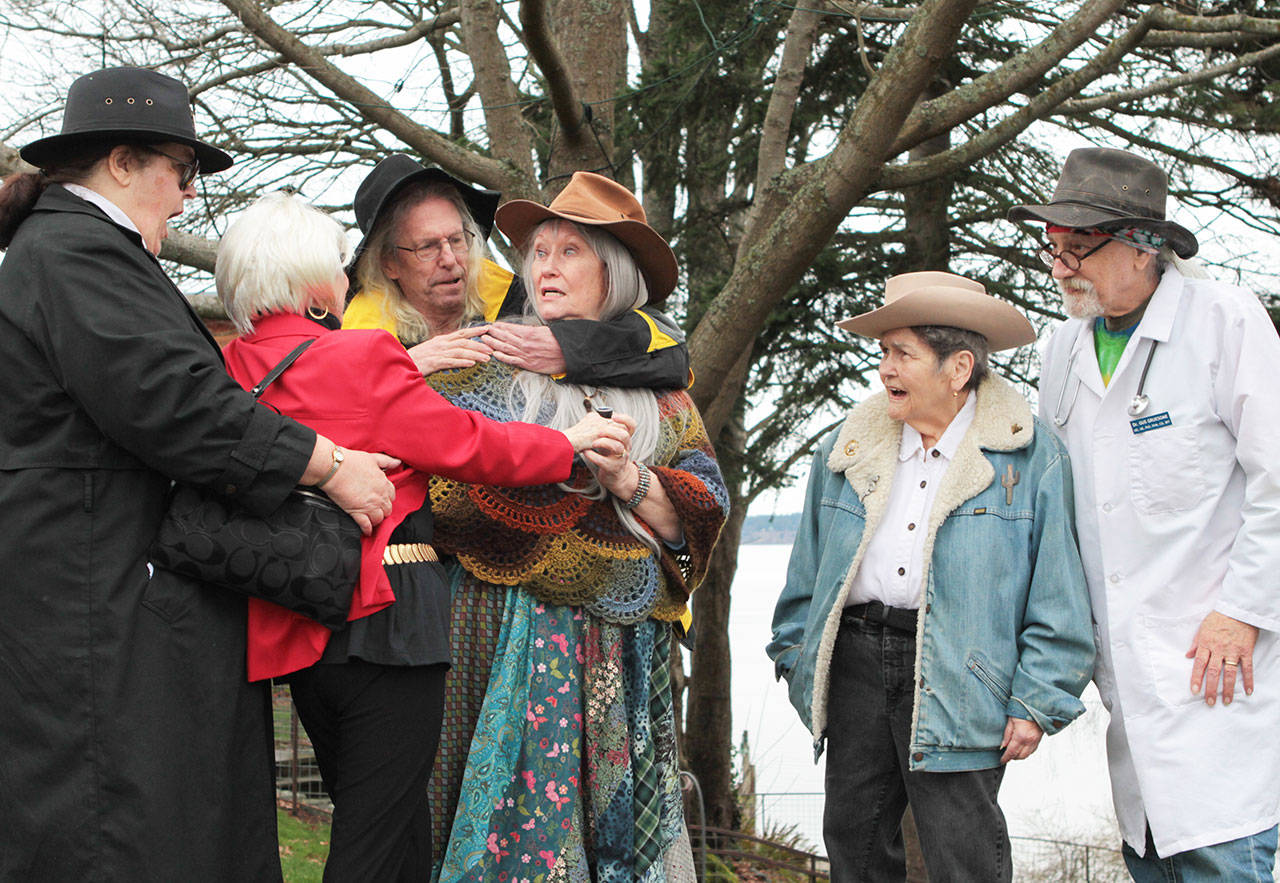 At the scene of the murder of merlin Mariner at Whale Bell Park, Officer Polly Graph and Ashford Gris break up a fight between the murdered man’s fiancé Goldie Digger and his estranged wife Rainy Gray. Detective I.B. Fuzz and Coroner Gus Gruesome, right, are shocked. Photo by Kramer O’Keefe.