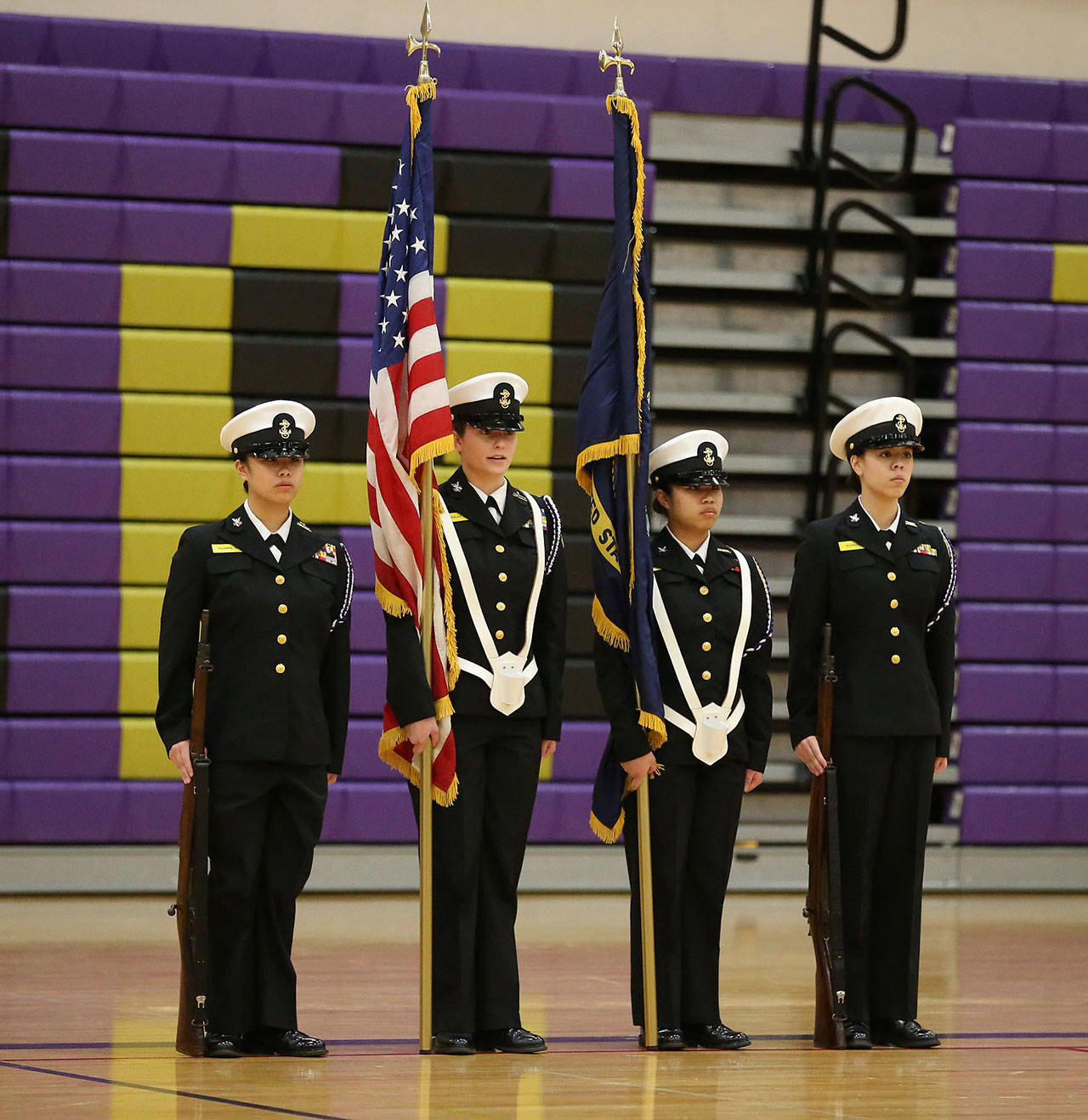Shaina Aguirre, left, Taylor Kesler, Elaine Aguirre and Jasmine Schultz represent Oak Harbor in the color guard competition.(Photo by John Fisken)