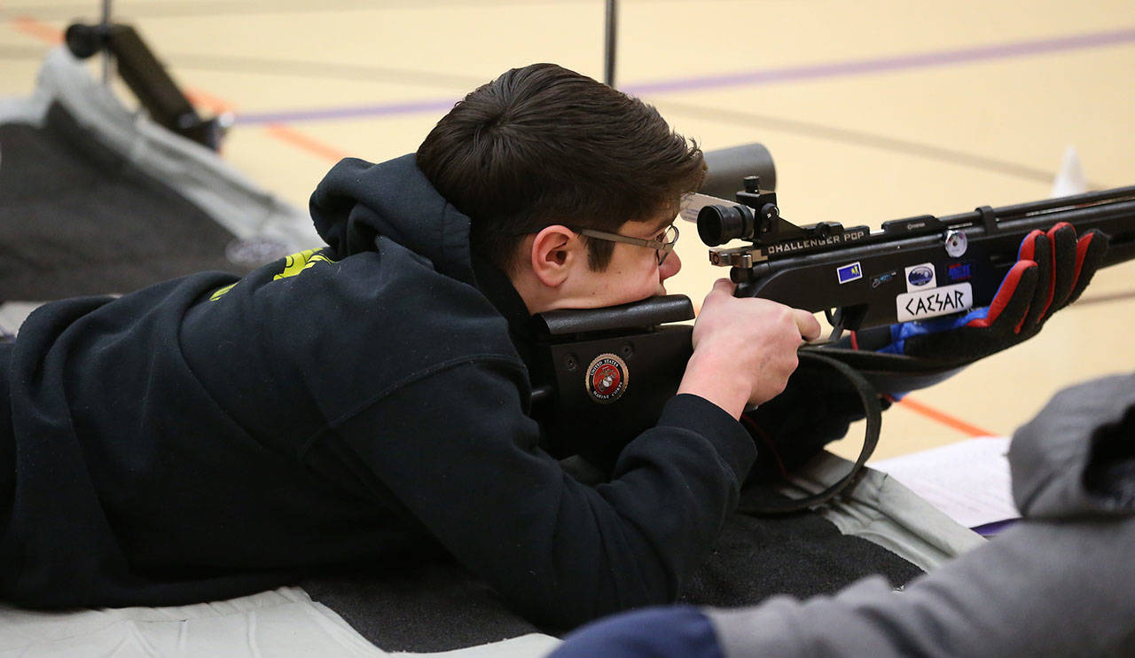 Oak Harbor’s Rylan Quiros shot his way to first place out of 60 competitors and led the Wildcats to a sweep of the top five spots in the sporter rifle competition Saturday. (Photo by John Fisken)