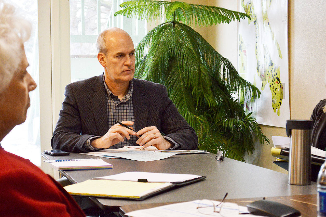 U.S. Rep. Rick Larsen listens during a roundtable discussion with officials from across Island County last Friday at the Economic Development Council. The meeting concluded his budget listening tour in which he discussed the potential impacts of President Trump’s proposed 2019 budget. Photo by Laura Guido/Whidbey News-Times