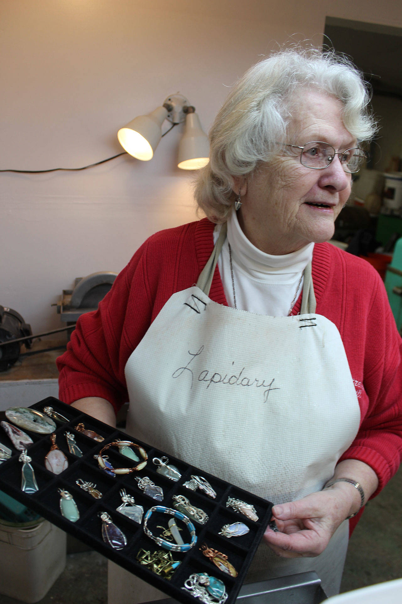 Pat Watt joined the Whidbey Island Gem Club at a friend’s suggestion three years ago. She quickly learned how to cut and shape stone into colorful pieces of jewelry. Photo by Patricia Guthrie/Whidbey News-Times