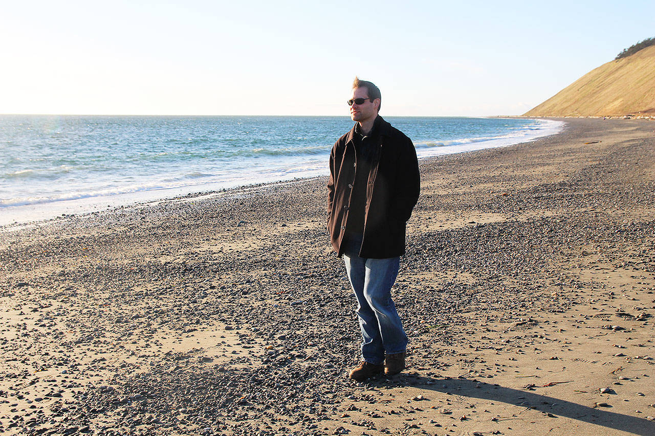Josh Spiegler walks along the beach at Ebey’s Landing. A water quality report recently released by the county showed high levels of fecal coliform in the surface water in the area, due to the nearby agricultural practices. Photo by Laura Guido/Whidbey News-Times