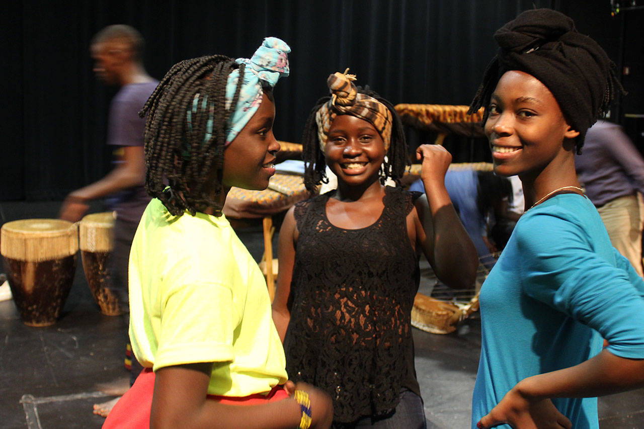 Members of Dance of Hope from Uganda take a break from rehearsing on the stage of South Whidbey High School where they’ll present a public performance Friday evening. Photos by Patricia Guthrie/Whidbey News-Group
