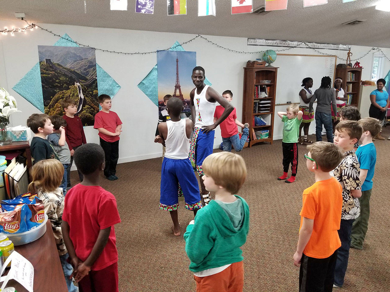 A different of sizes becomes apparent as Dance of Hope performers from Uganda visit Wellington Day School on South Whidbey. Photo provided