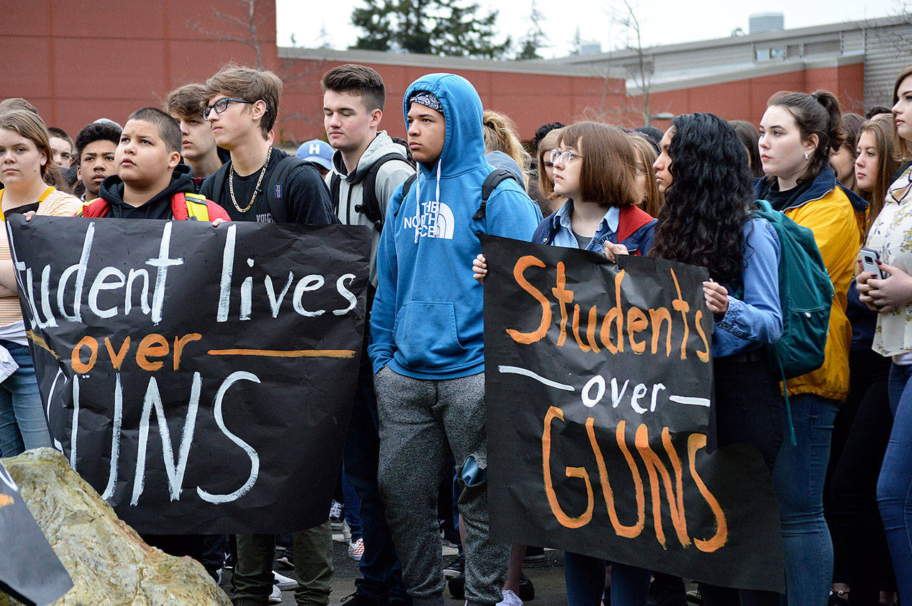 Oak Harbor High School students joined thousands of young people across the nation at 10 a.m. Wednesday for a 17-minute walkout to advocate for stricter gun control and to honor the 17 victims of the shooting in Parkland, Fla. Photo by Laura Guido/Whidbey News-Times