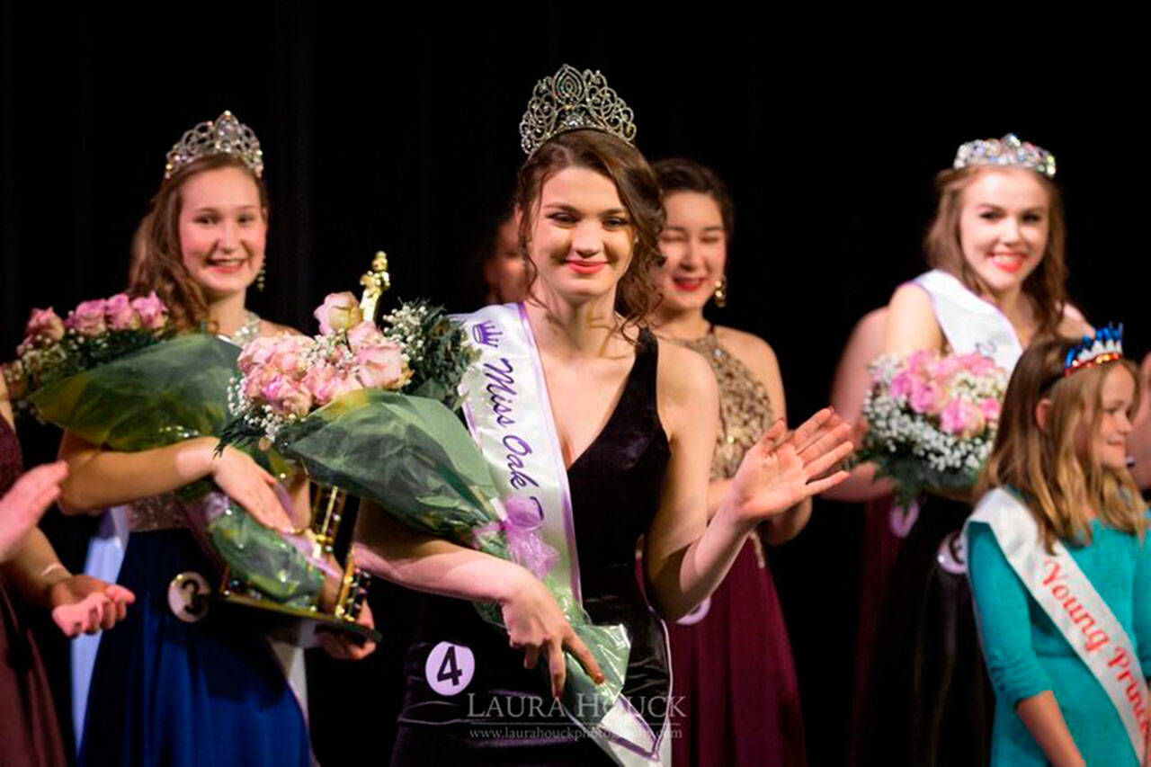 Photo by Laura Houck                                Tia Miesle, waving, was crowned Miss Oak Harbor 2018 during the March 10 Miss Oak Harbor Pageant.