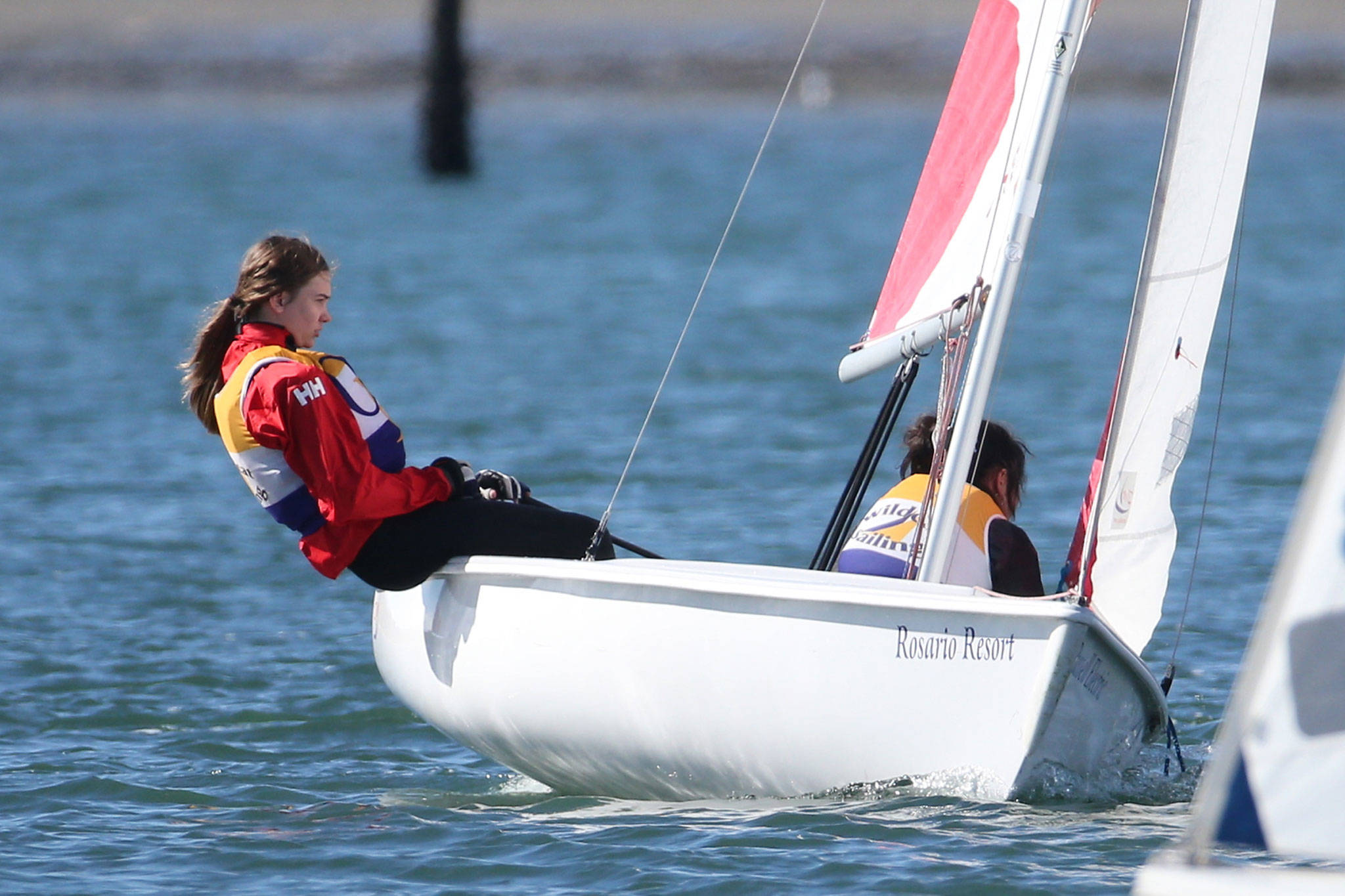 Jenny Danielson, left, and Catherine Wicker compete for the Wildcat sailing team last weekend. (Photo by John Fisken)
