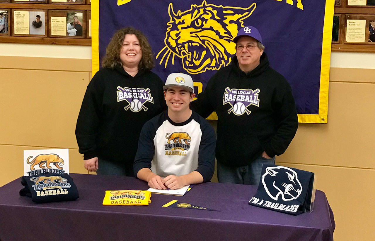 James Besaw, flanked by his parents Teresa and Jim at the letter signing Wednesday, will play baseball next year for MCLA. (Submitted photo)