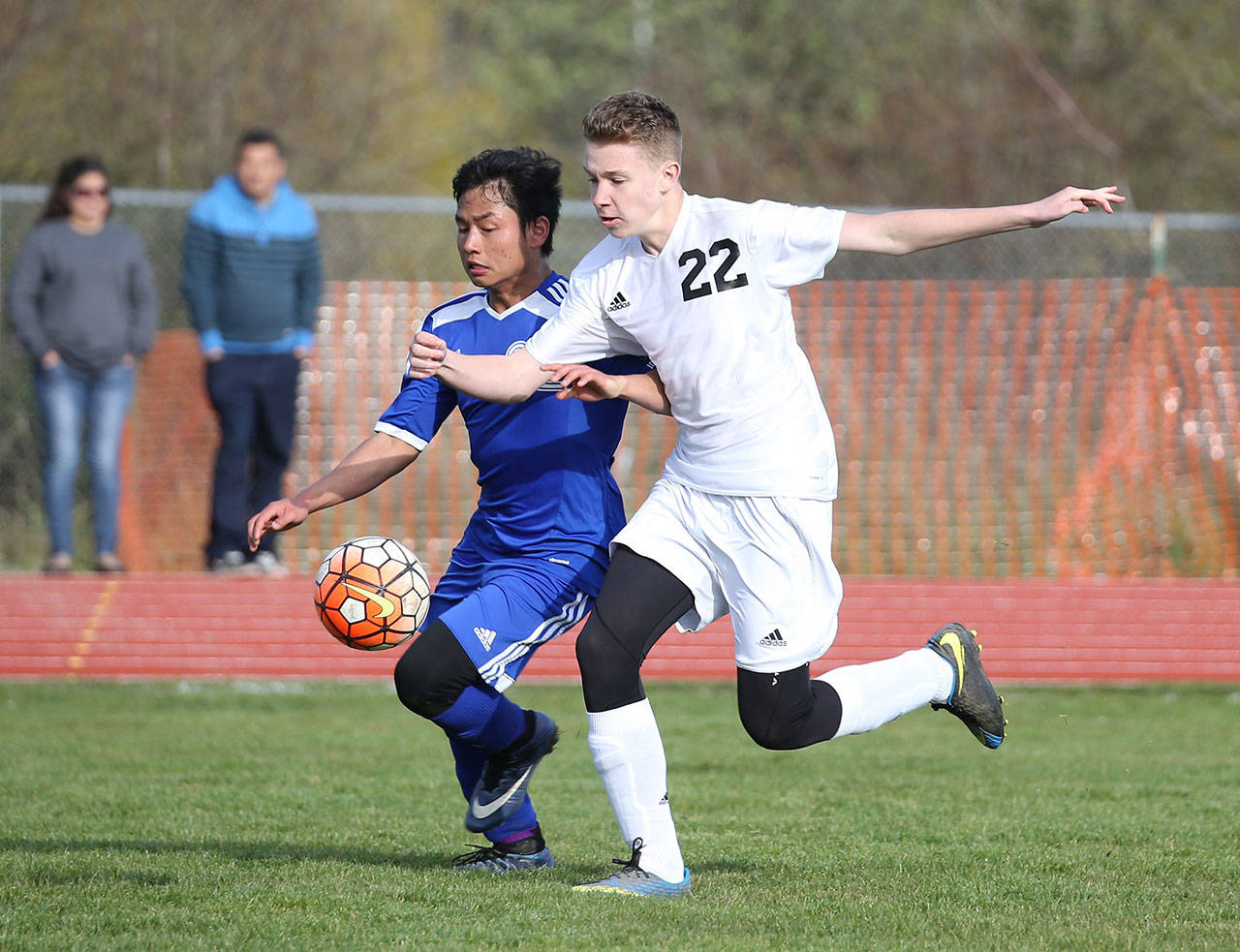 Coupeville’s Ben Smith, right, battles a Chimacum player for possession in Friday’s match.(Photo by John Fisken)