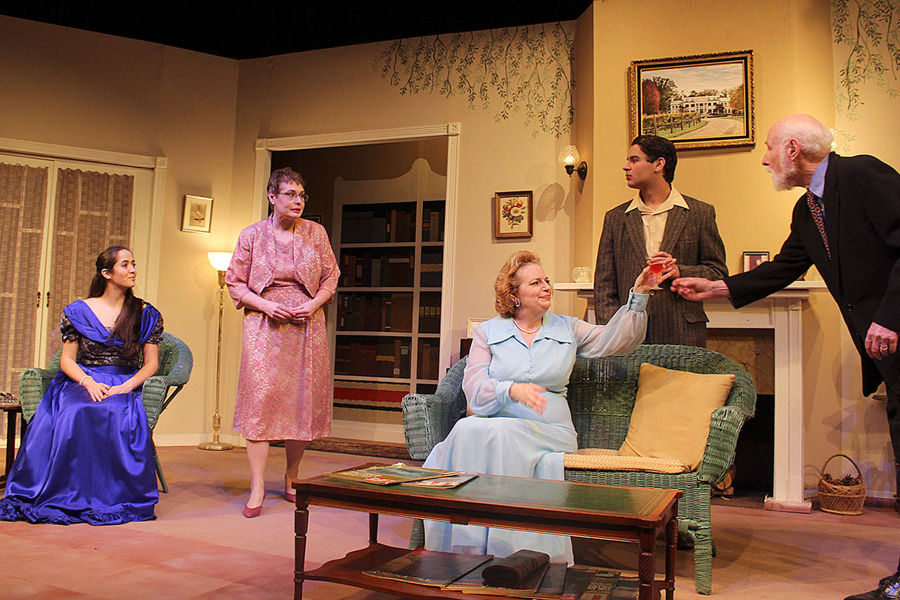 Col. Henry Angkatell played by Jack McPherson (far right) serves Miss Lucy Angkatell (Ingrid Schwalbe) a drink prior to a formal dinner in the couples mansion. Other actors, left to right, are Trinity Slowik (Midge Harvey), Lisa Judd (Gertie Cristow) and Warren Rogers (Edward Angkatell.) Photos by Patricia Guthrie/Whidbey News Group