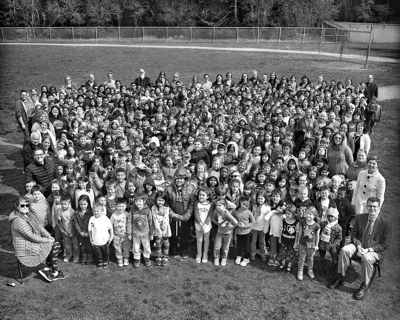 Olympic View Elementary School staff, students and the superintendent pose for a photo taken by teacher Cameron Cornell with his 1944 8x10 camera. An archival print of the photo, along with portraits and letters by students and teachers will be locked in a time capsule toward the end of the year. Photo provided