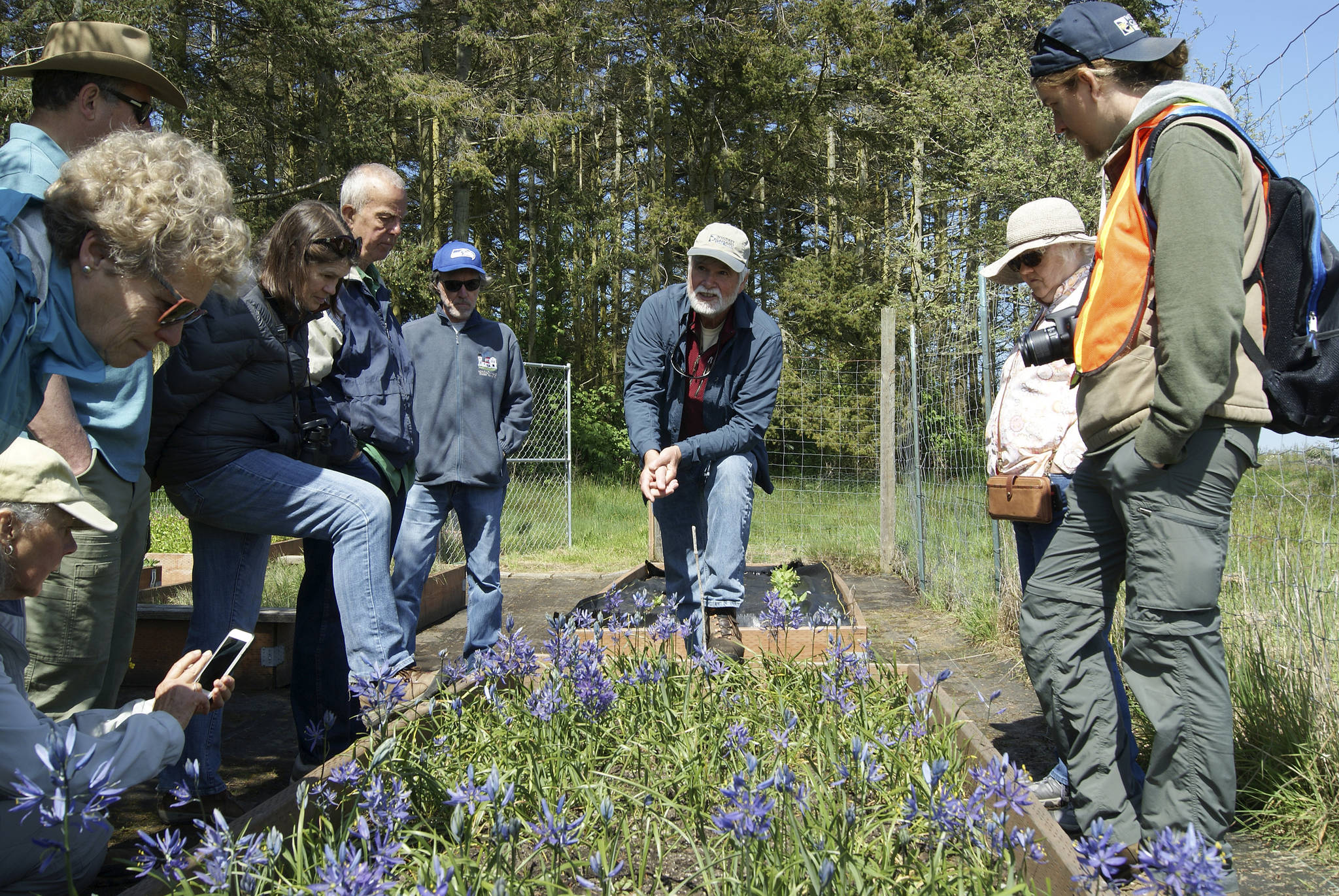 Photos by Maria Matson/Whidbey News-Times                                Consultant biologist Mark Sheehan discusses the nursery run by the Whidbey Camano Land Trust .