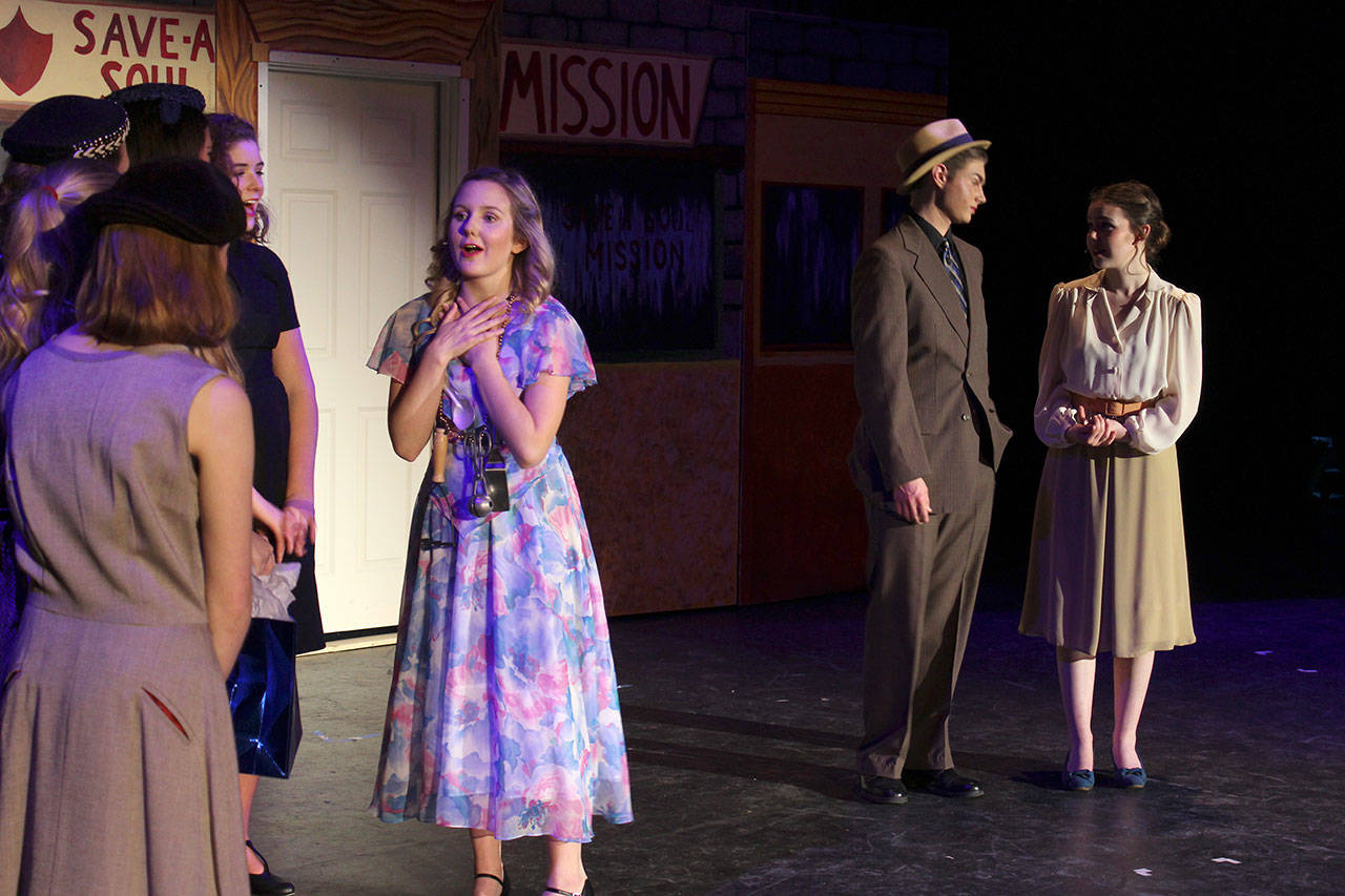 Oak Harbor High School presents the musical, “Guys & Dolls” through May 12. Directed by Linda McLean, students starring in lead roles are Ella Langrock, center, Carl Davis and Kaitlin Barrailler (far right.)                                Photo by Patricia Guthrie/Whidbey News Group